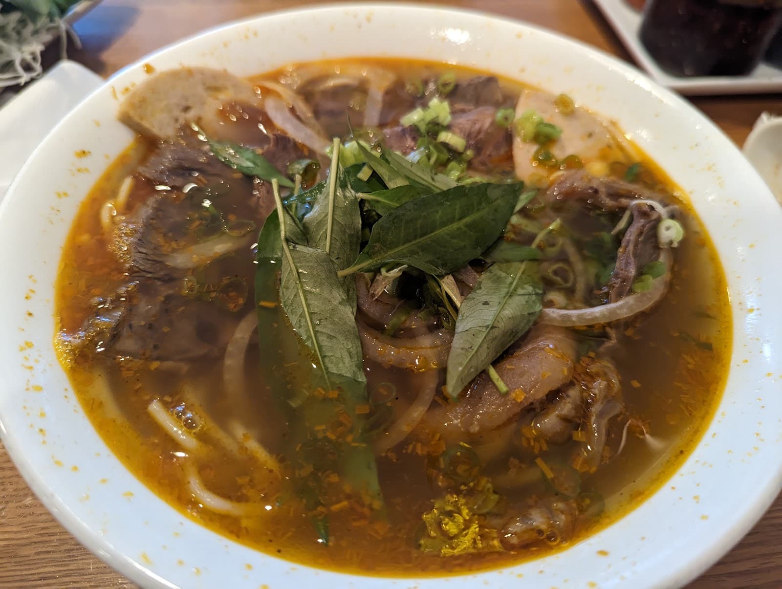 Vermicelli bowl with grilled pork, fresh herbs, and pickled vegetables
