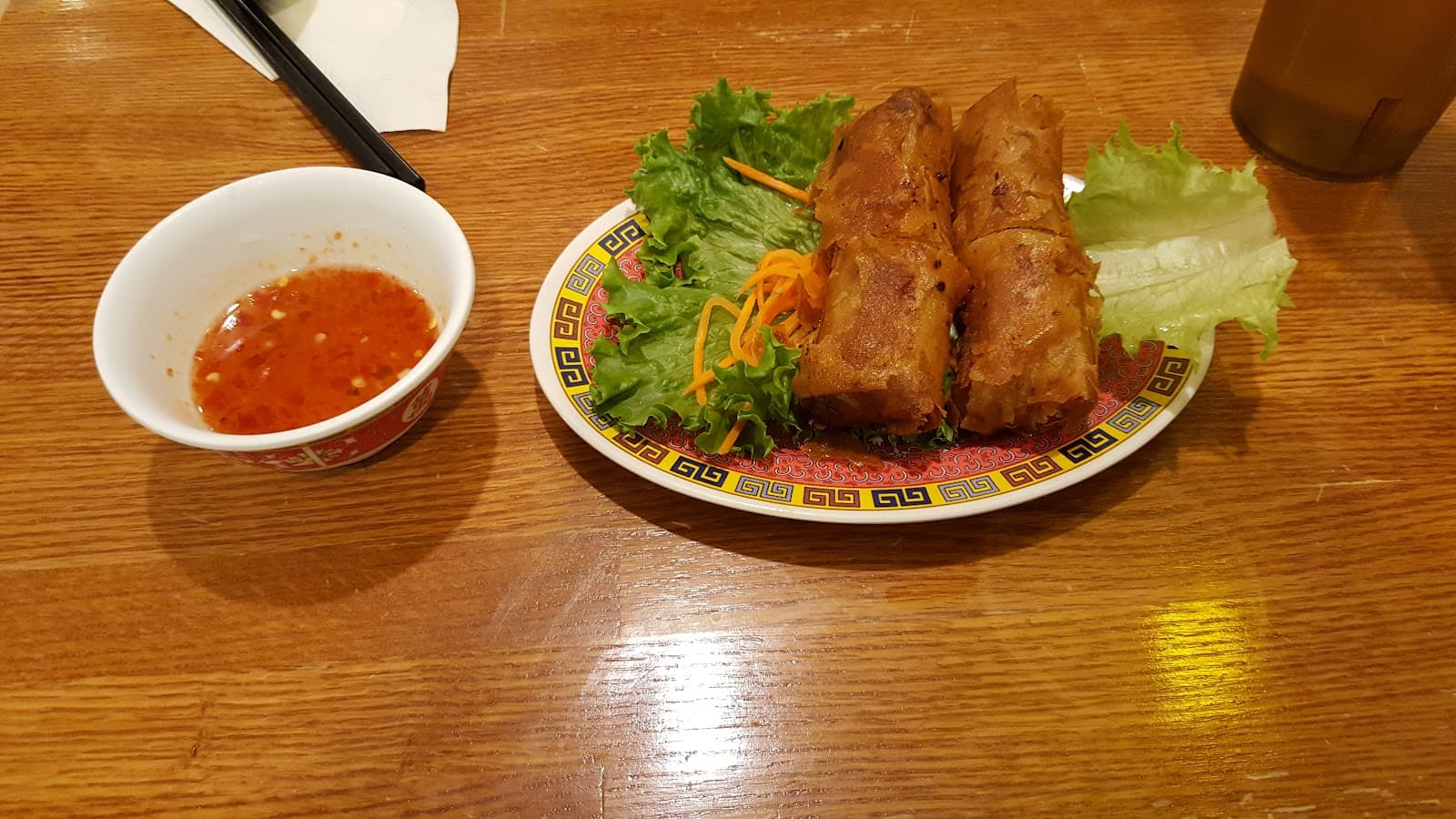 Inside Pho 24 — warm dining room with wooden furnishings and a welcoming atmosphere